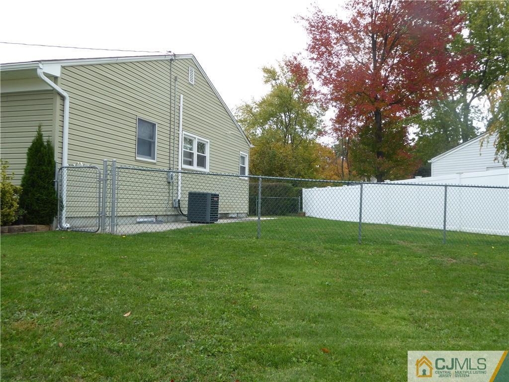 102 Stony Road Edison, NJ 08817 - Photo 3 of 21 a view of a backyard with a garden