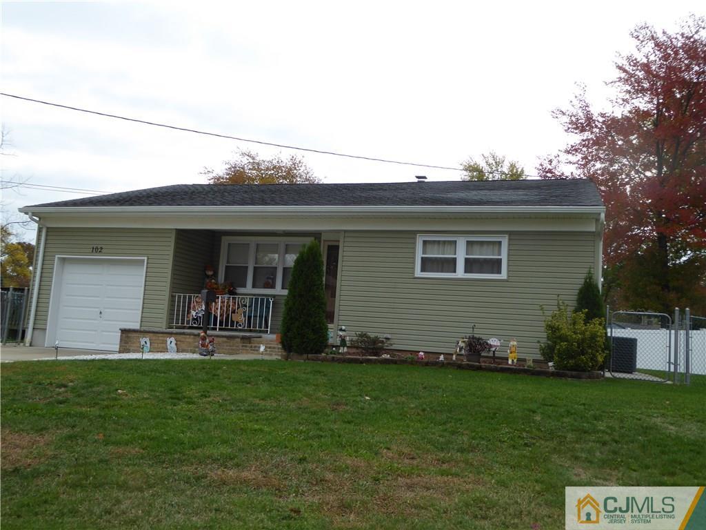 102 Stony Road Edison, NJ 08817 - Photo 21 of 21 a front view of a house with a garden