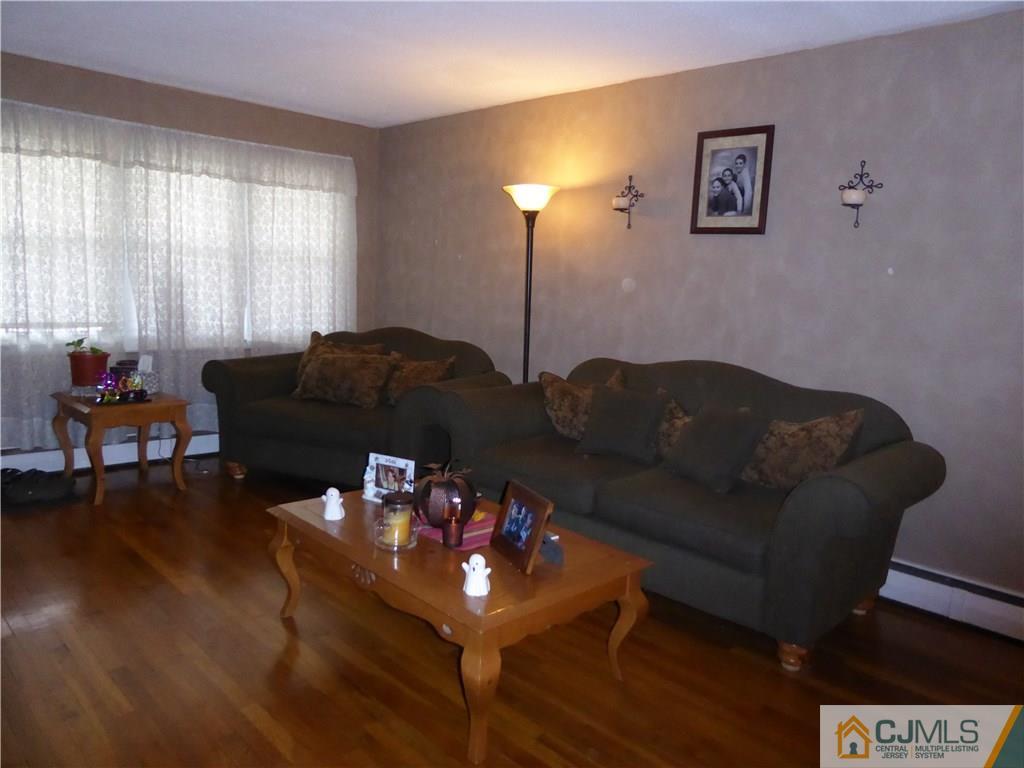 102 Stony Road Edison, NJ 08817 - Photo 5 of 21 a living room with furniture and wooden floor