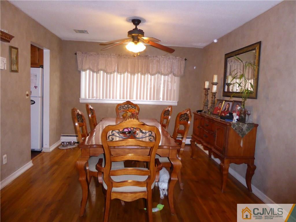 102 Stony Road Edison, NJ 08817 - Photo 6 of 21 a view of a dining room with furniture and chandelier