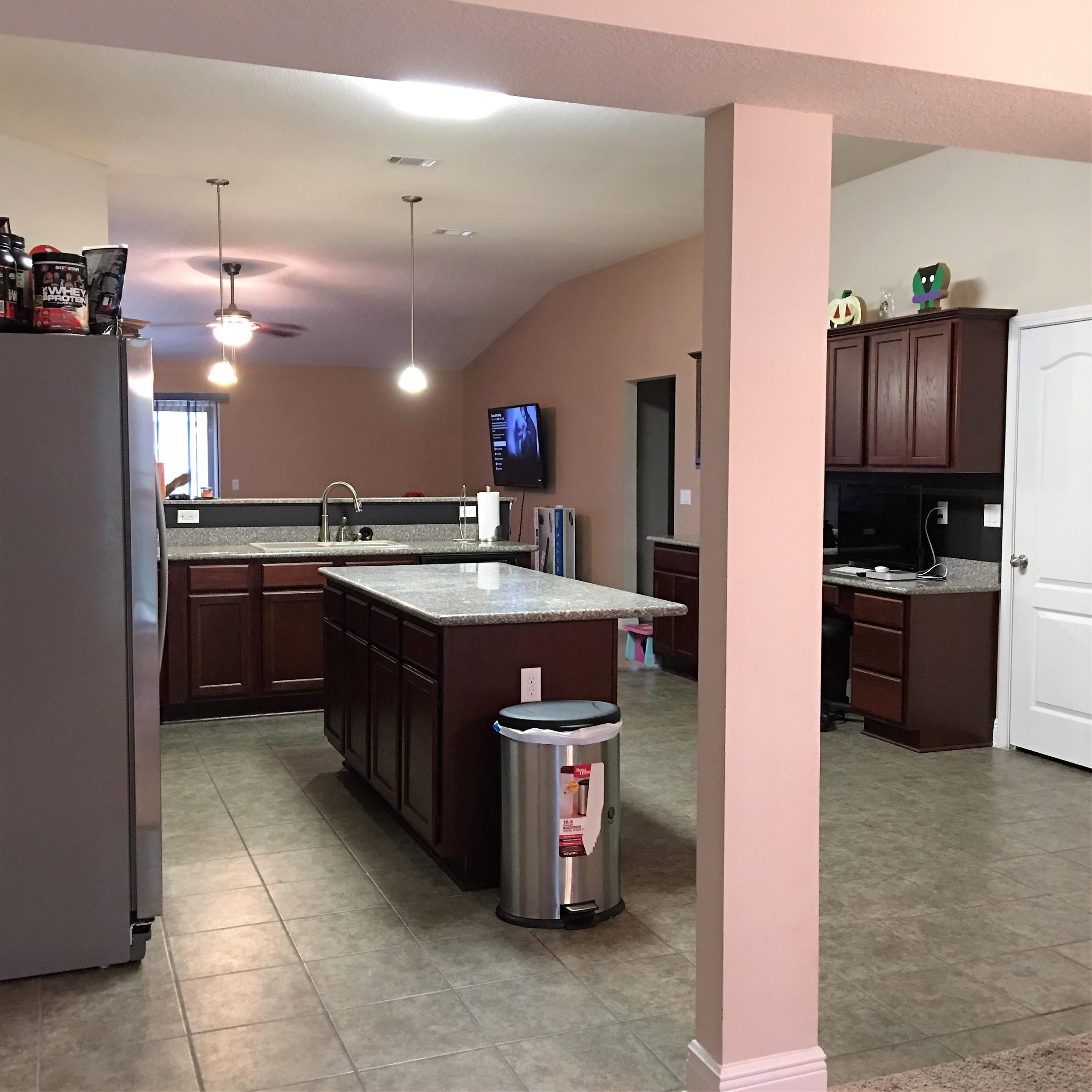 4519 Hermosa Road Crestview, FL 32539 - Photo 3 of 34 a kitchen with stainless steel appliances granite countertop a sink a stove and a refrigerator