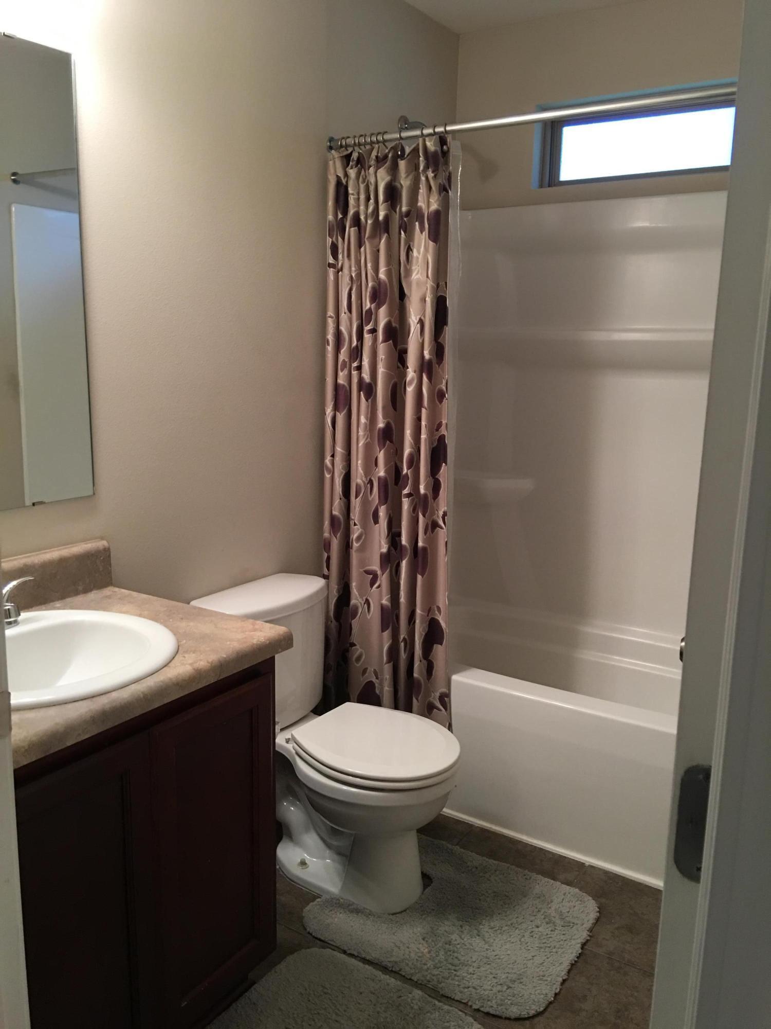 4519 Hermosa Road Crestview, FL 32539 - Photo 22 of 34 a bathroom with a sink toilet and shower