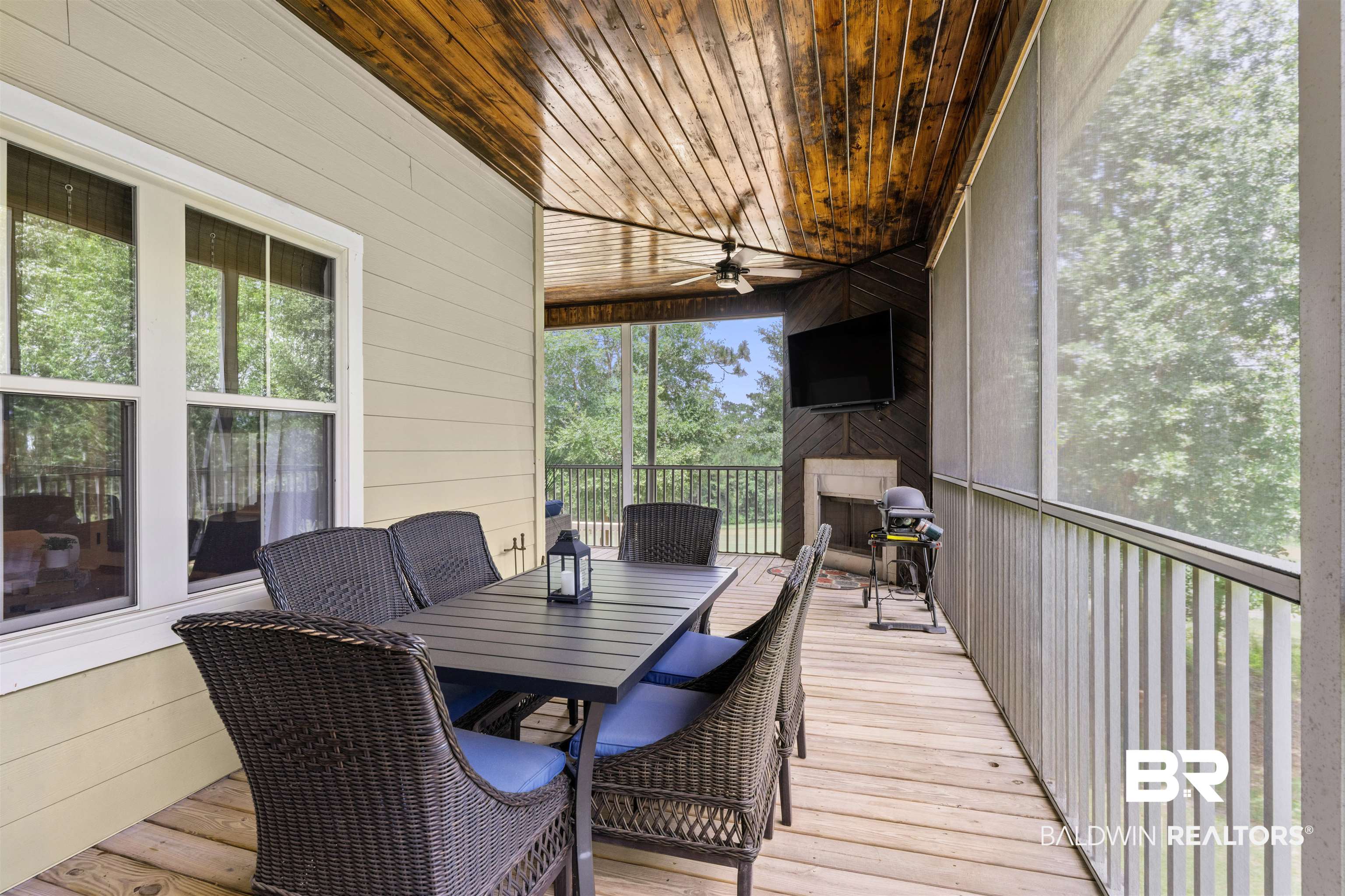 32700 Steelwood Ridge Road, Unit D Loxley, AL 36551 - Photo 30 of 41 Screened porch featuring a natural wood plank ceiling, light wood-finish flooring, and a ceiling fan