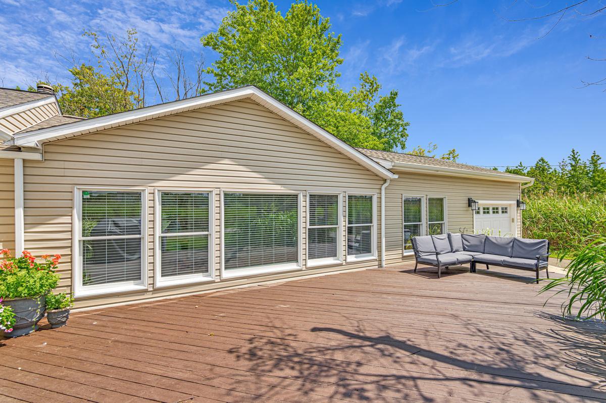 1410 Dent Road Shady Side, MD 20764 - Photo 4 of 42 Sunny retreat with spacious deck, front of home.