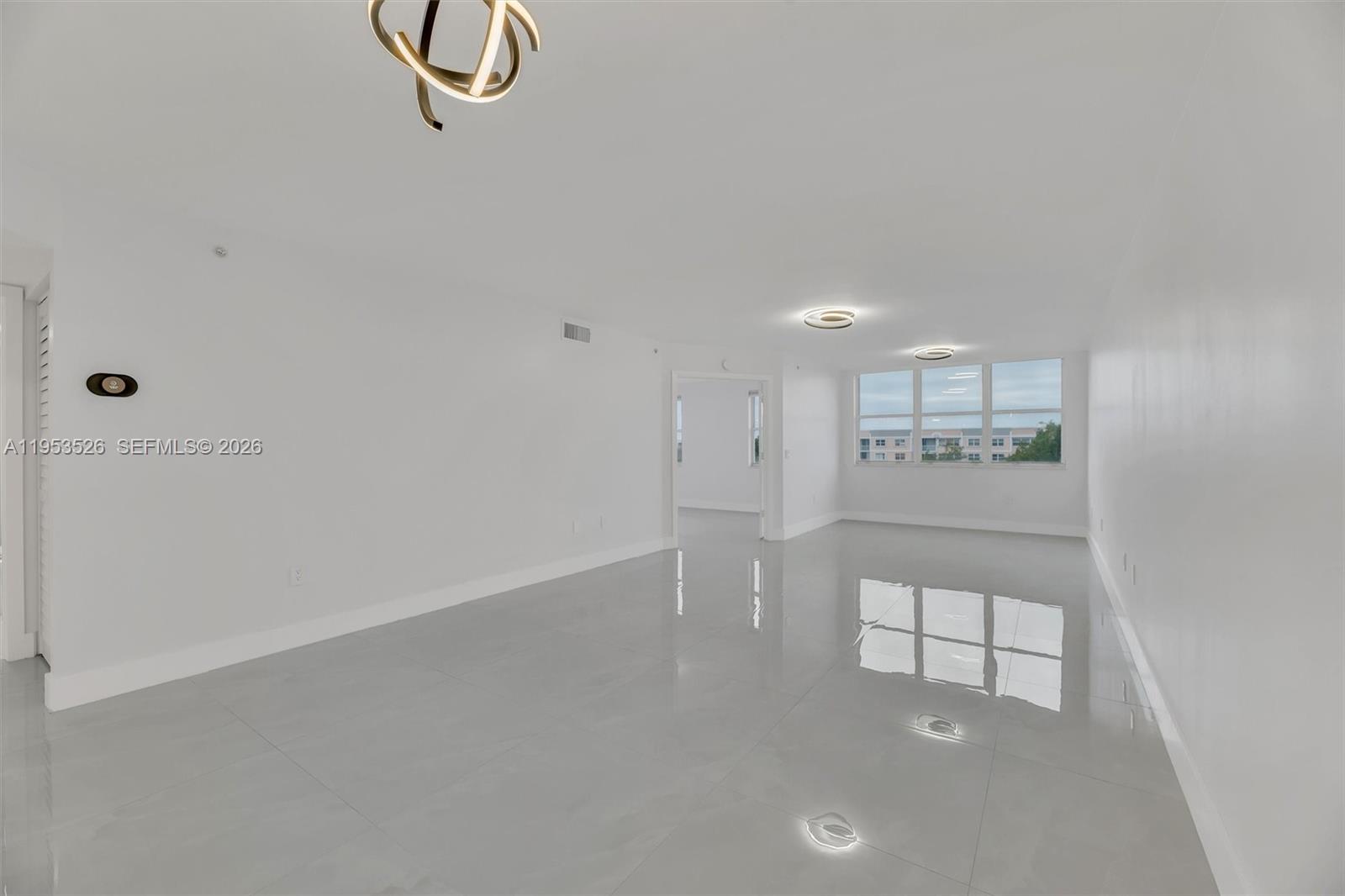 2601 North Nob Hill Road, Unit 407 Sunrise, FL 33322 - Photo 13 of 38 a view of an empty room