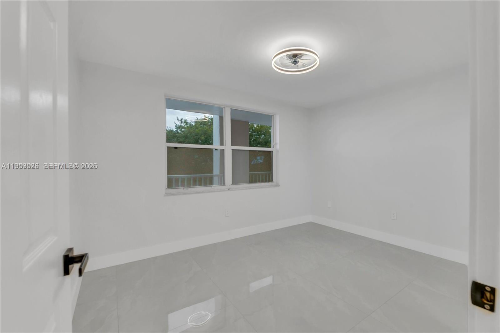 2601 North Nob Hill Road, Unit 407 Sunrise, FL 33322 - Photo 27 of 38 a view of empty room with windows