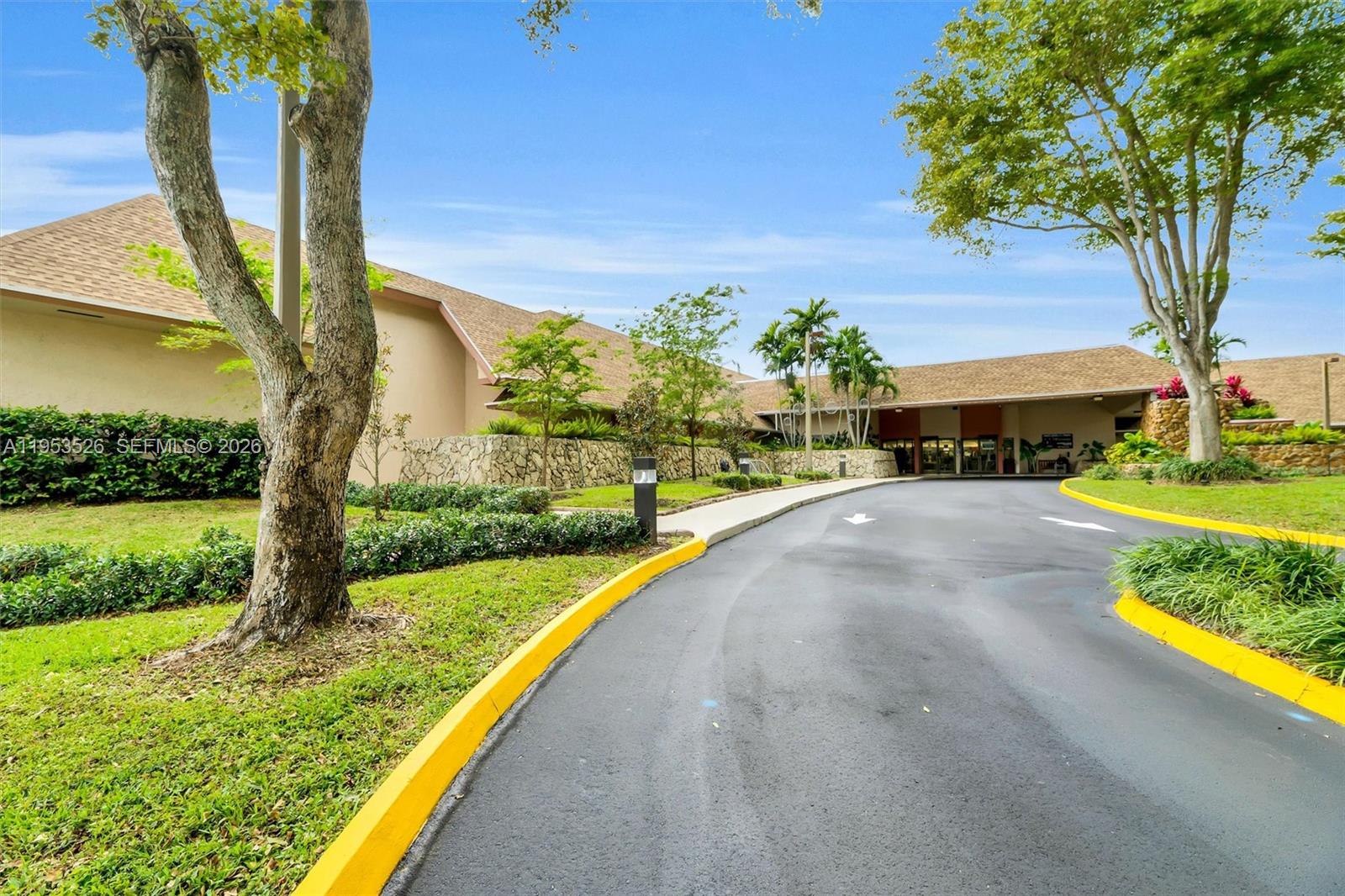 2601 North Nob Hill Road, Unit 407 Sunrise, FL 33322 - Photo 36 of 38 a view of swimming pool from a garden