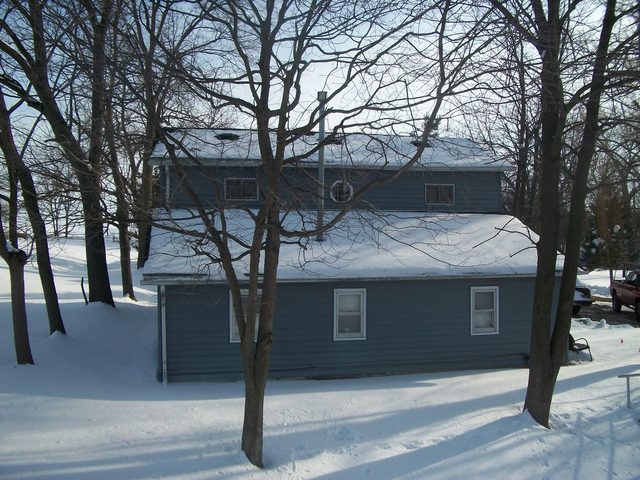 2755 Shaw Road Compton, IL 61318 - Photo 16 of 21 a yellow house with trees in front of it