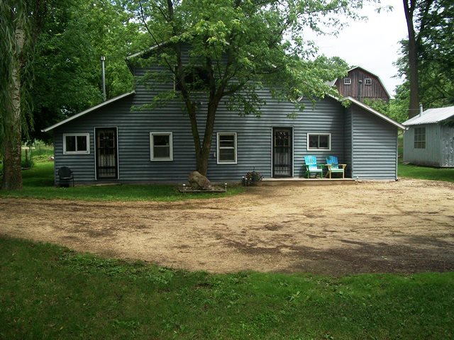 2755 Shaw Road Compton, IL 61318 - Photo 21 of 21 a backyard of a house with large trees and brick walls