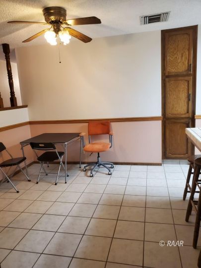 342 East Wilson Avenue Ridgecrest, CA 93555 - Photo 8 of 27 a room with a table and a rug