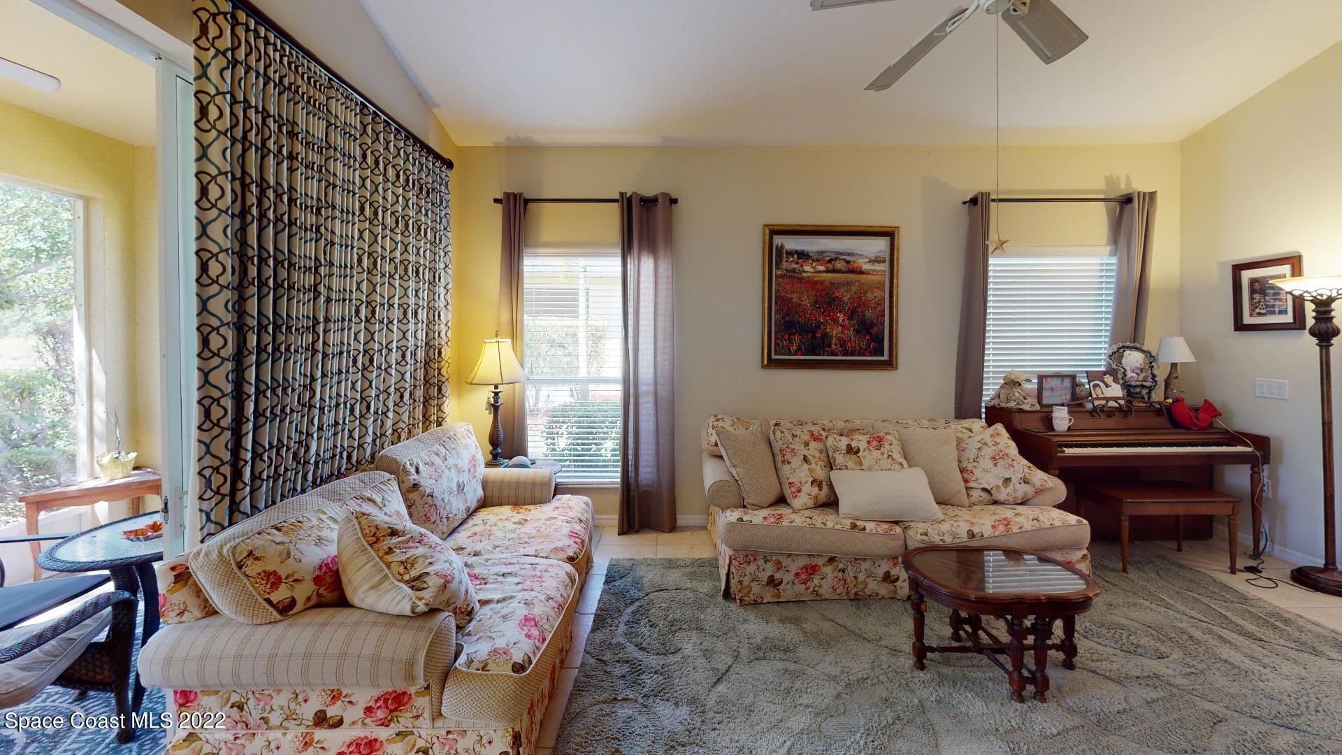 3151 Le Conte Street Melbourne, FL 32940 - Photo 12 of 30 a living room with furniture and a large window