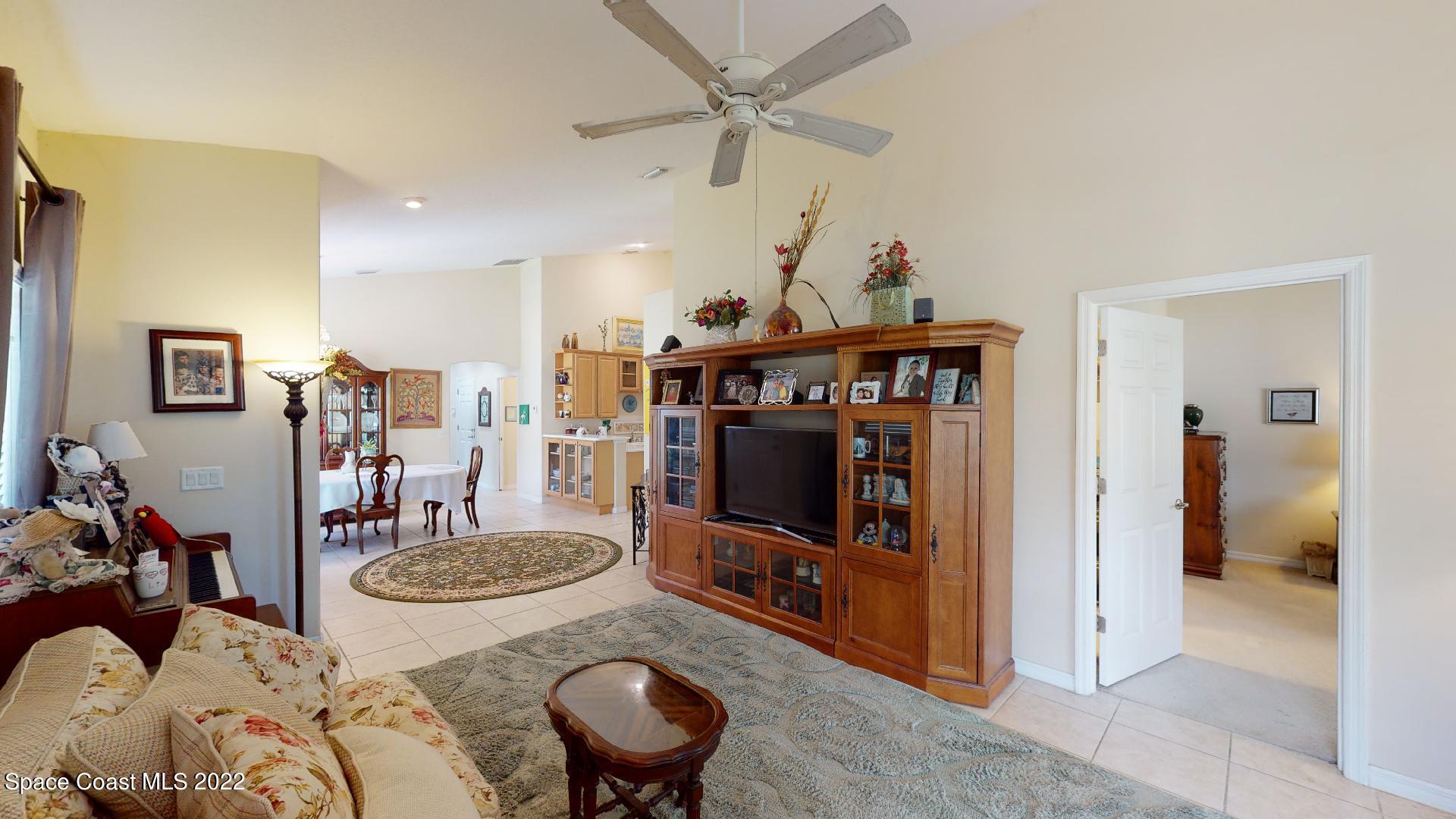 3151 Le Conte Street Melbourne, FL 32940 - Photo 14 of 30 a living room with furniture and a flat screen tv