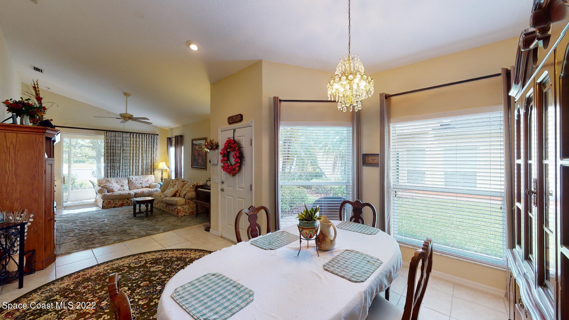 3151 Le Conte Street Melbourne, FL 32940 - Photo 15 of 30 a view of a dining room with furniture window and outside view