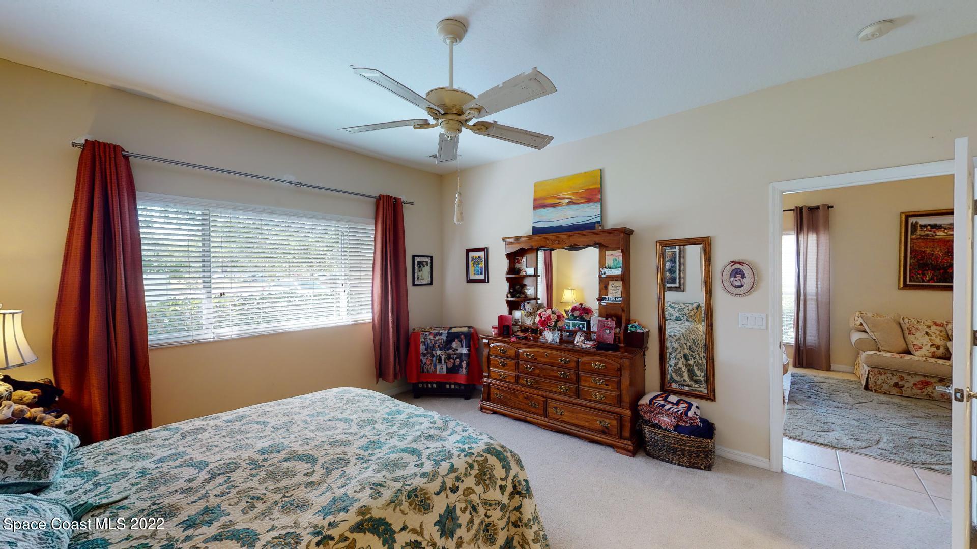 3151 Le Conte Street Melbourne, FL 32940 - Photo 21 of 30 a bedroom with bed and window