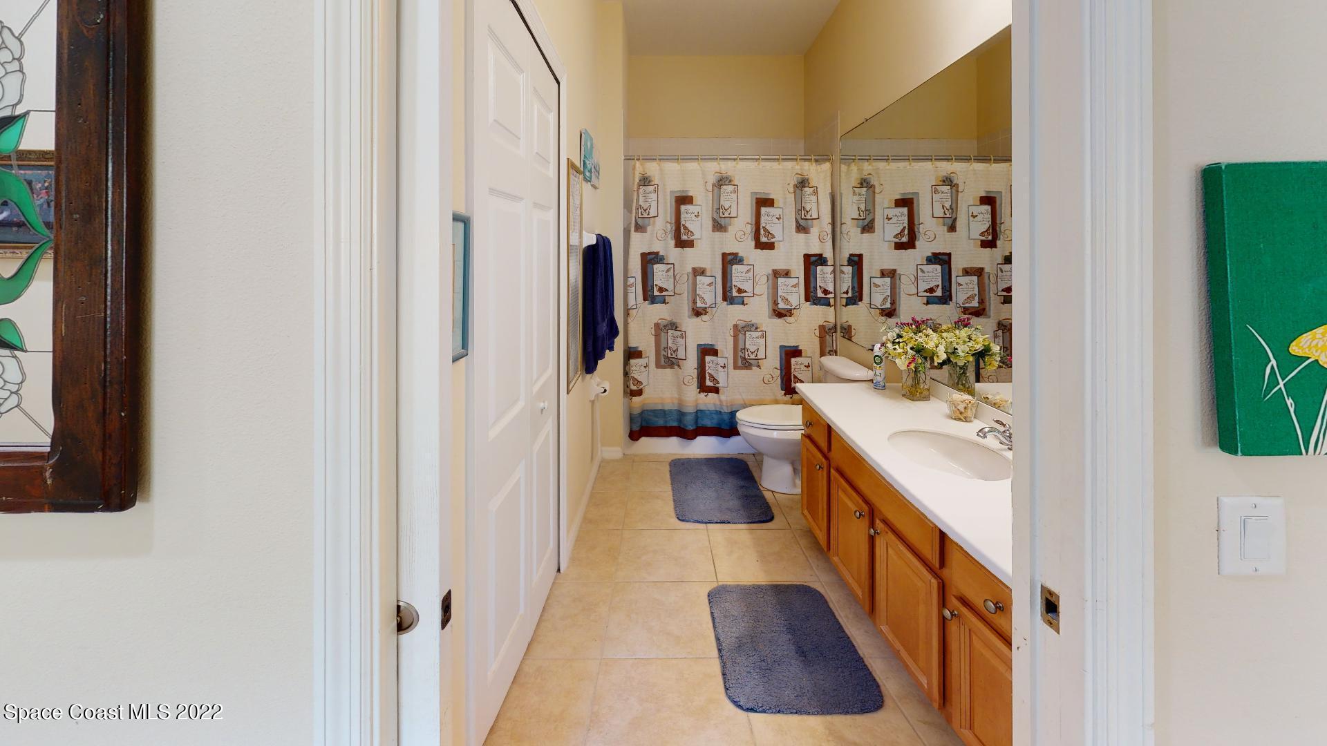 3151 Le Conte Street Melbourne, FL 32940 - Photo 27 of 30 a bathroom with a bathtub sink and toilet
