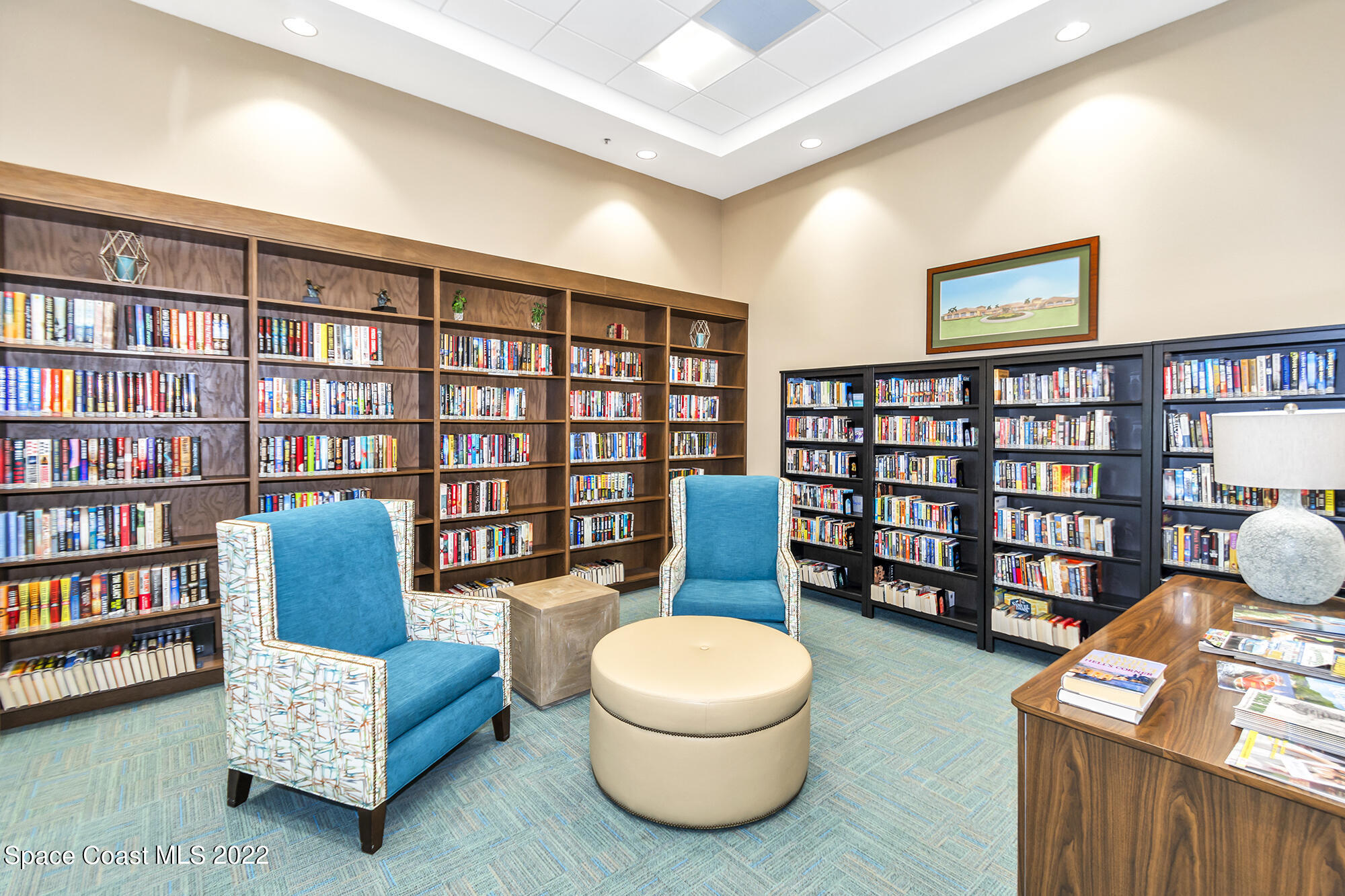 3151 Le Conte Street Melbourne, FL 32940 - Photo 28 of 30 a living room with furniture and a book shelf
