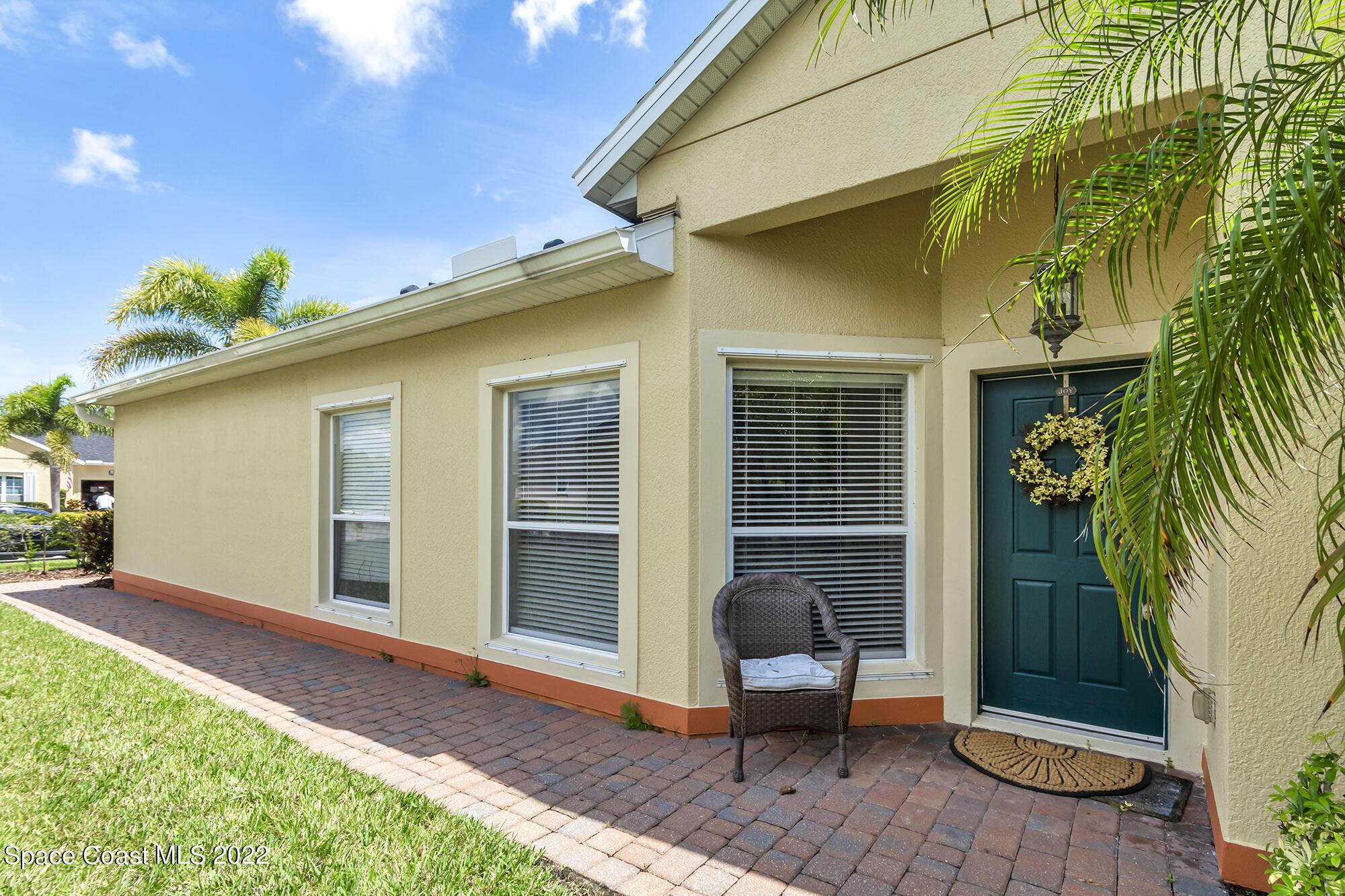 3151 Le Conte Street Melbourne, FL 32940 - Photo 7 of 30 a view of a backyard with chairs potted plants and wooden fence