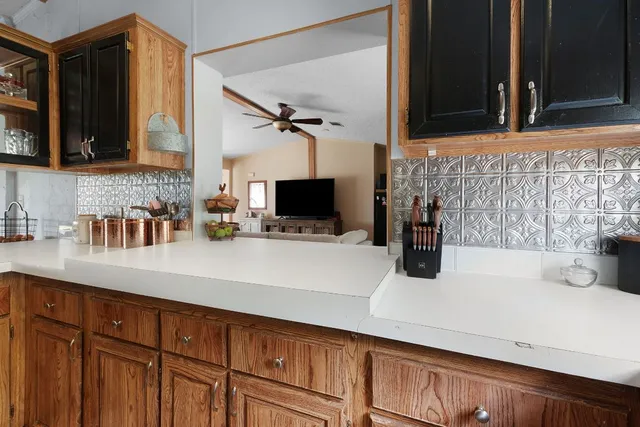 a kitchen with a sink and a microwave