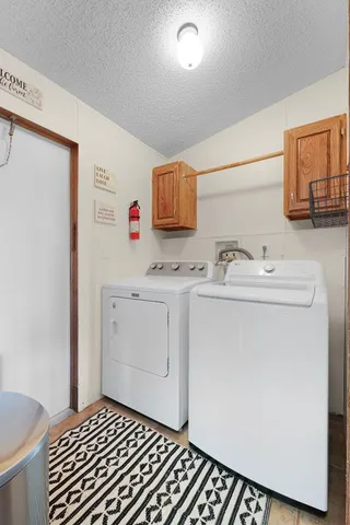 a utility room with a sink washer and dryer