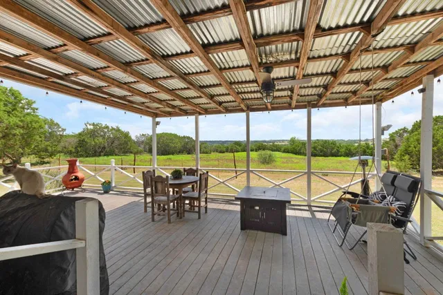 a view of a patio with swimming pool table and chairs