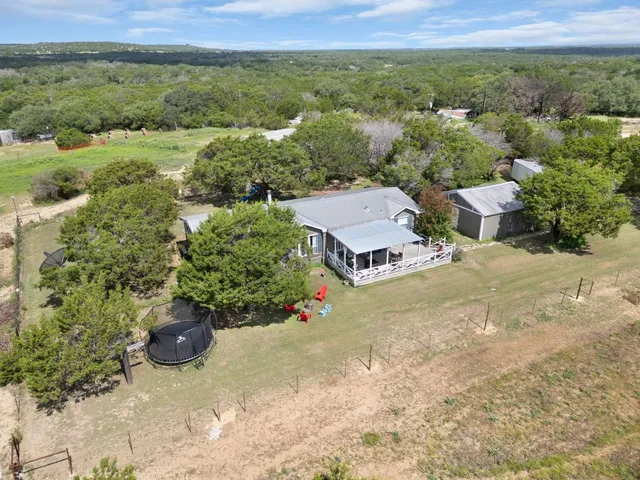 an aerial view of a house with a garden