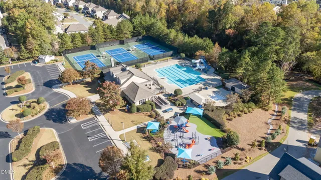 an aerial view of a house with yard