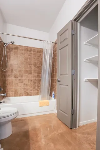 a bathroom with a bathtub and a shower