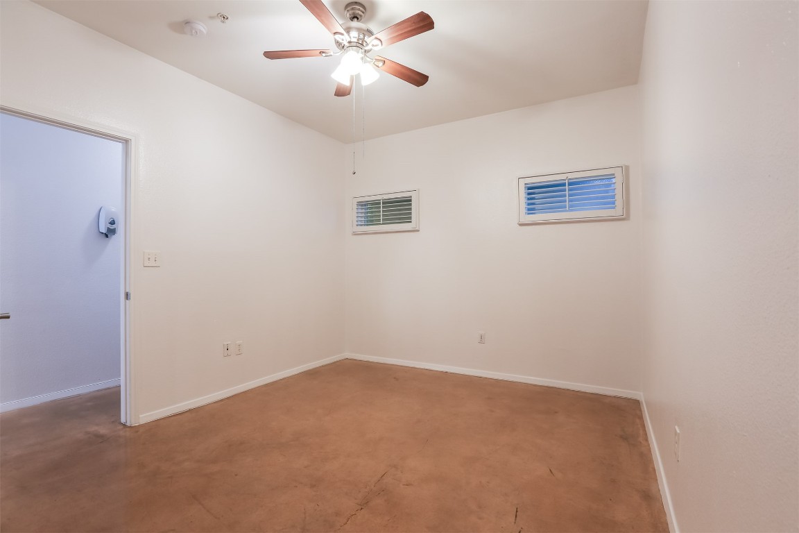 910 West 25th Street, Unit 509 Austin, TX 78705 - Photo 19 of 31 an empty room with a window and a fan