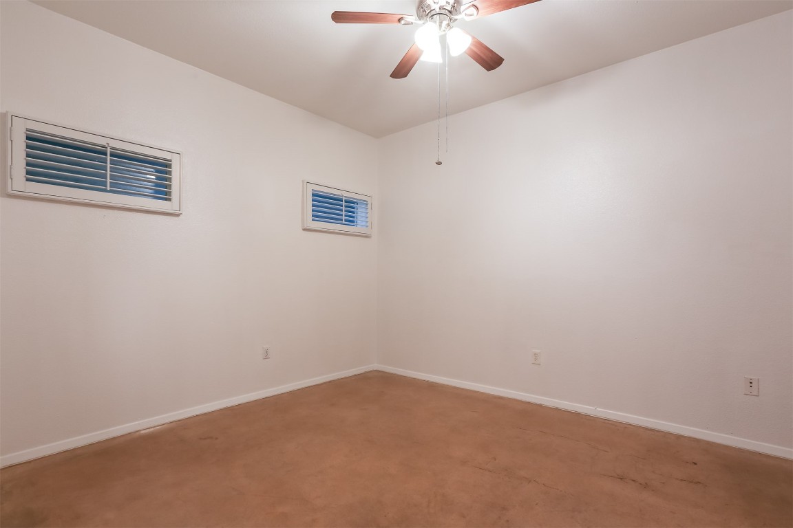 910 West 25th Street, Unit 509 Austin, TX 78705 - Photo 20 of 31 a view of an empty room with a chandelier fan