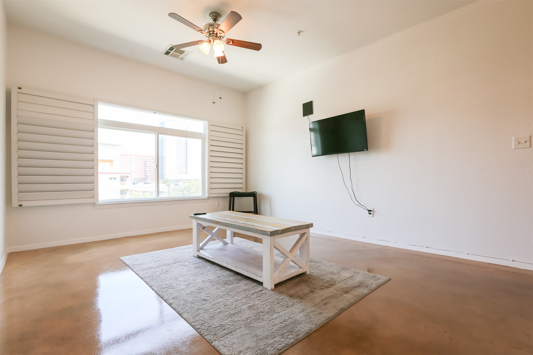 910 West 25th Street, Unit 509 Austin, TX 78705 - Photo 2 of 31 a living room with couch and a flat screen tv