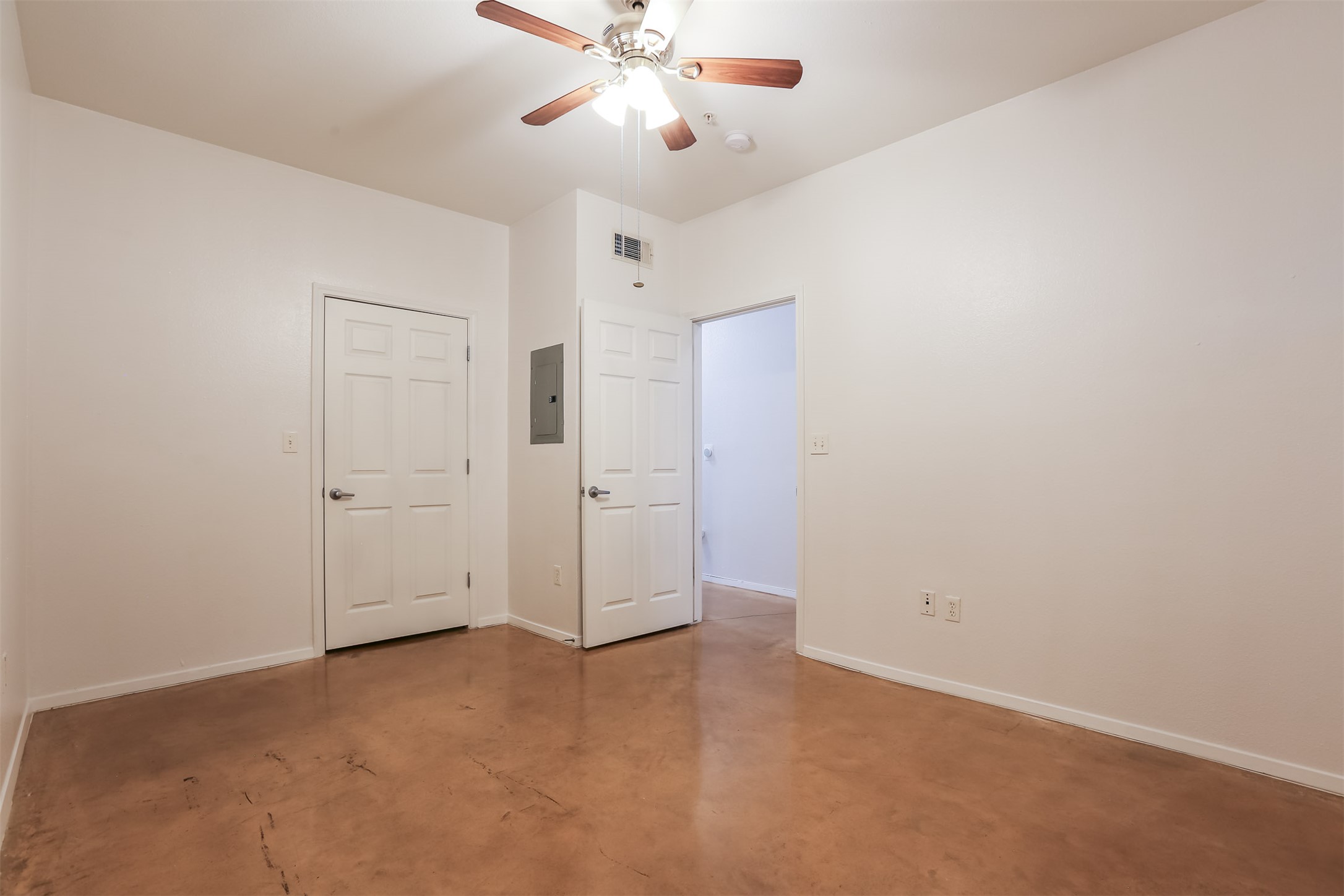 910 West 25th Street, Unit 509 Austin, TX 78705 - Photo 21 of 31 an empty room with closet and a chandelier fan