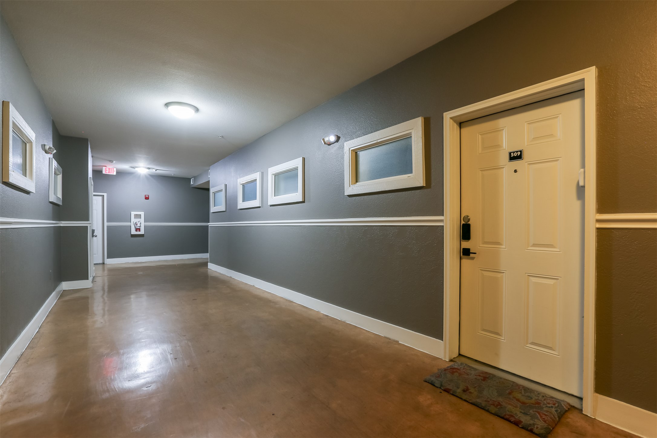 910 West 25th Street, Unit 509 Austin, TX 78705 - Photo 24 of 31 a view of empty room with wooden floor and windows