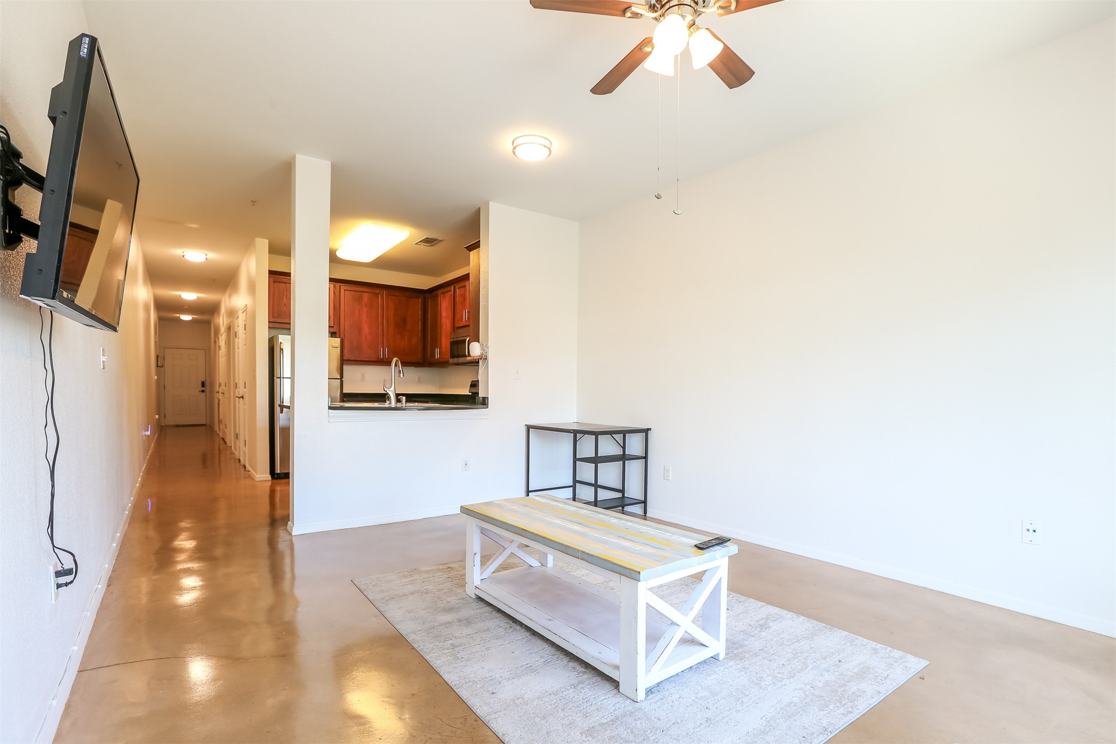 910 West 25th Street, Unit 509 Austin, TX 78705 - Photo 4 of 31 a spacious bedroom with a bed and a chandelier