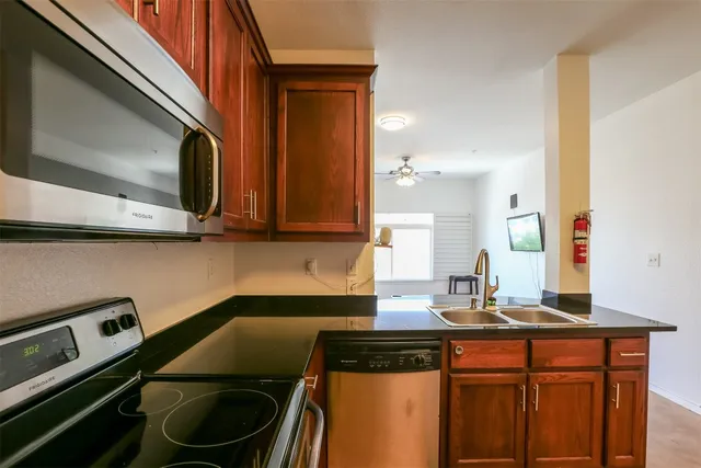 a kitchen with a sink and cabinets