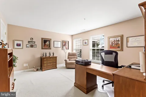 a view of a workspace with furniture