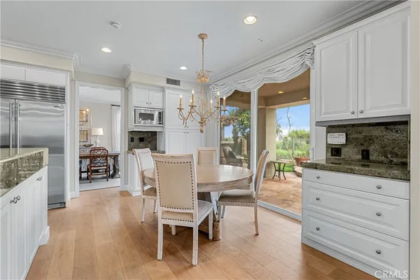 a kitchen with stainless steel appliances granite countertop a sink and a granite counter tops