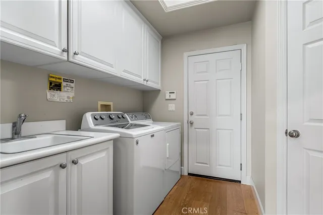 a bathroom with a sink mirror and toilet
