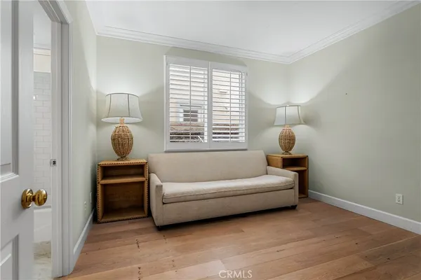 a living room with furniture a fireplace and a floor to ceiling window