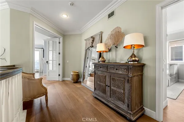a spacious bathroom with a tub a double vanity sink large mirror and a bathtub