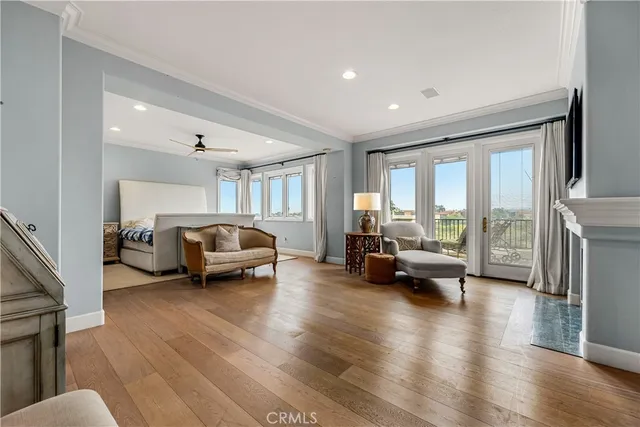 a spacious bathroom with a tub a double vanity sink large mirror and a bathtub