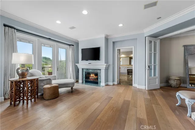 a view of hallway with furniture and a chandelier