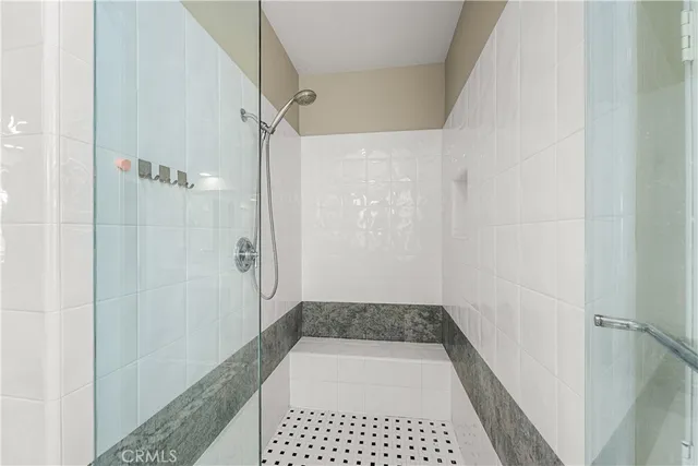 a bedroom with a bed and windows