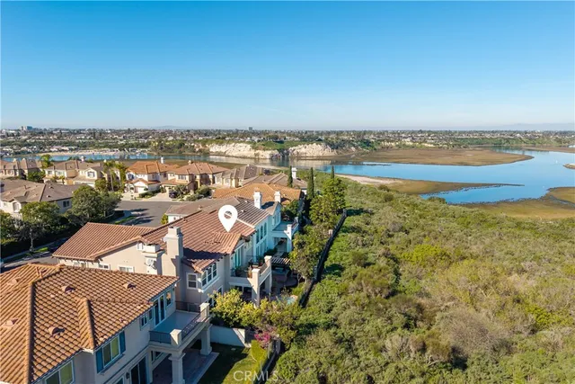 an aerial view of a house with a lake view