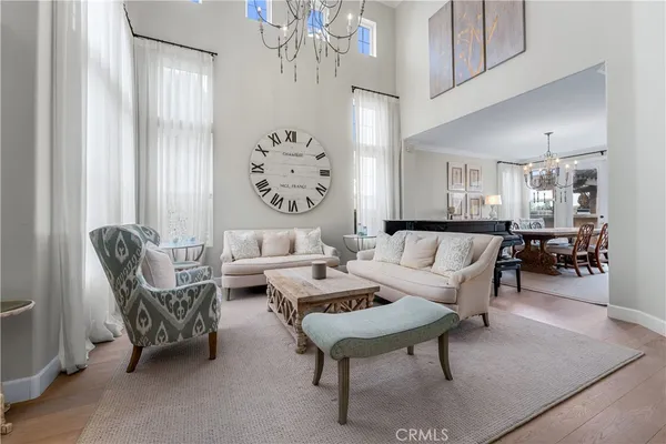 a living room with furniture and stairs