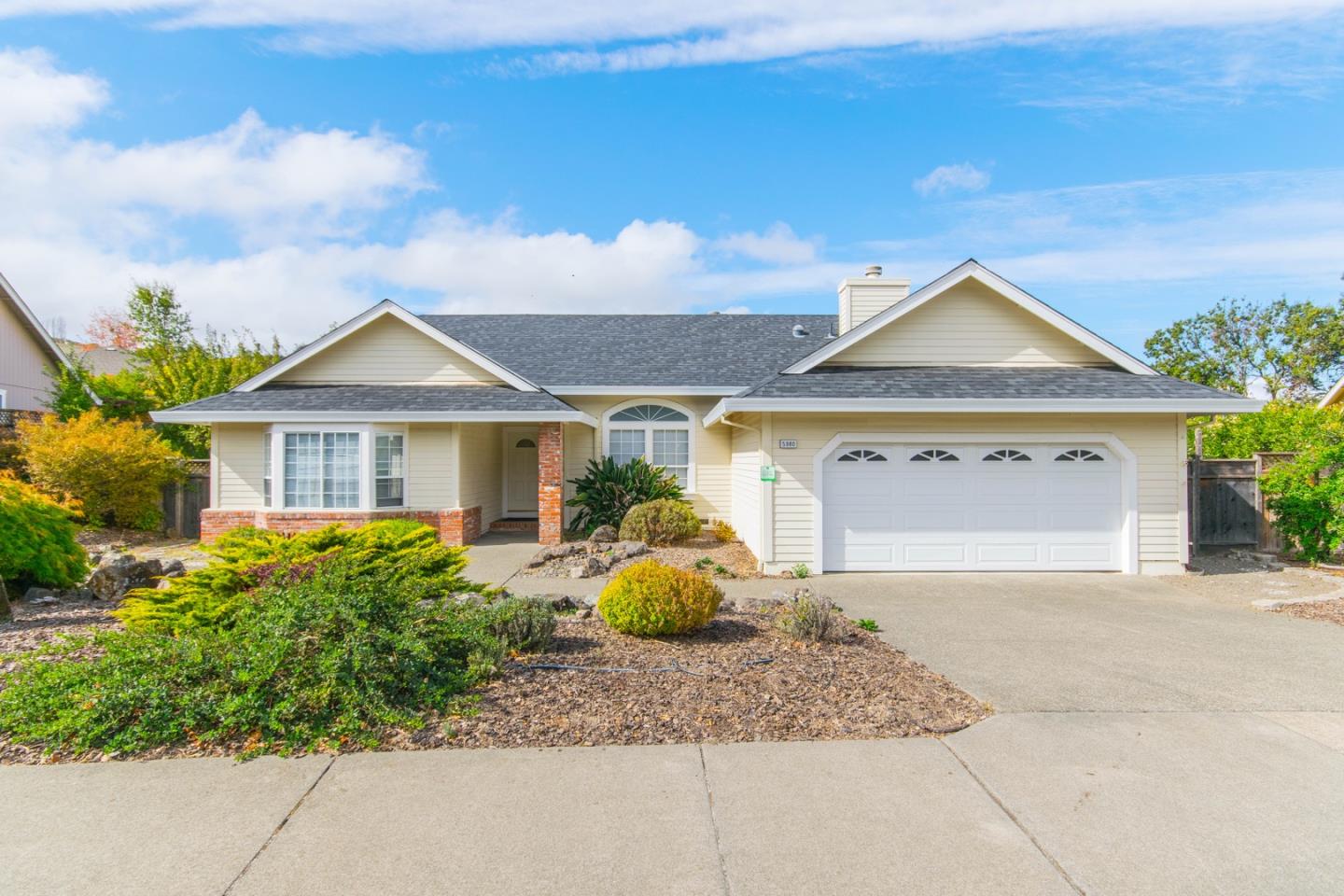 5980 Stone Bridge Road Santa Rosa, CA 95409 - Photo 1 of 24 a front view of a house with garden