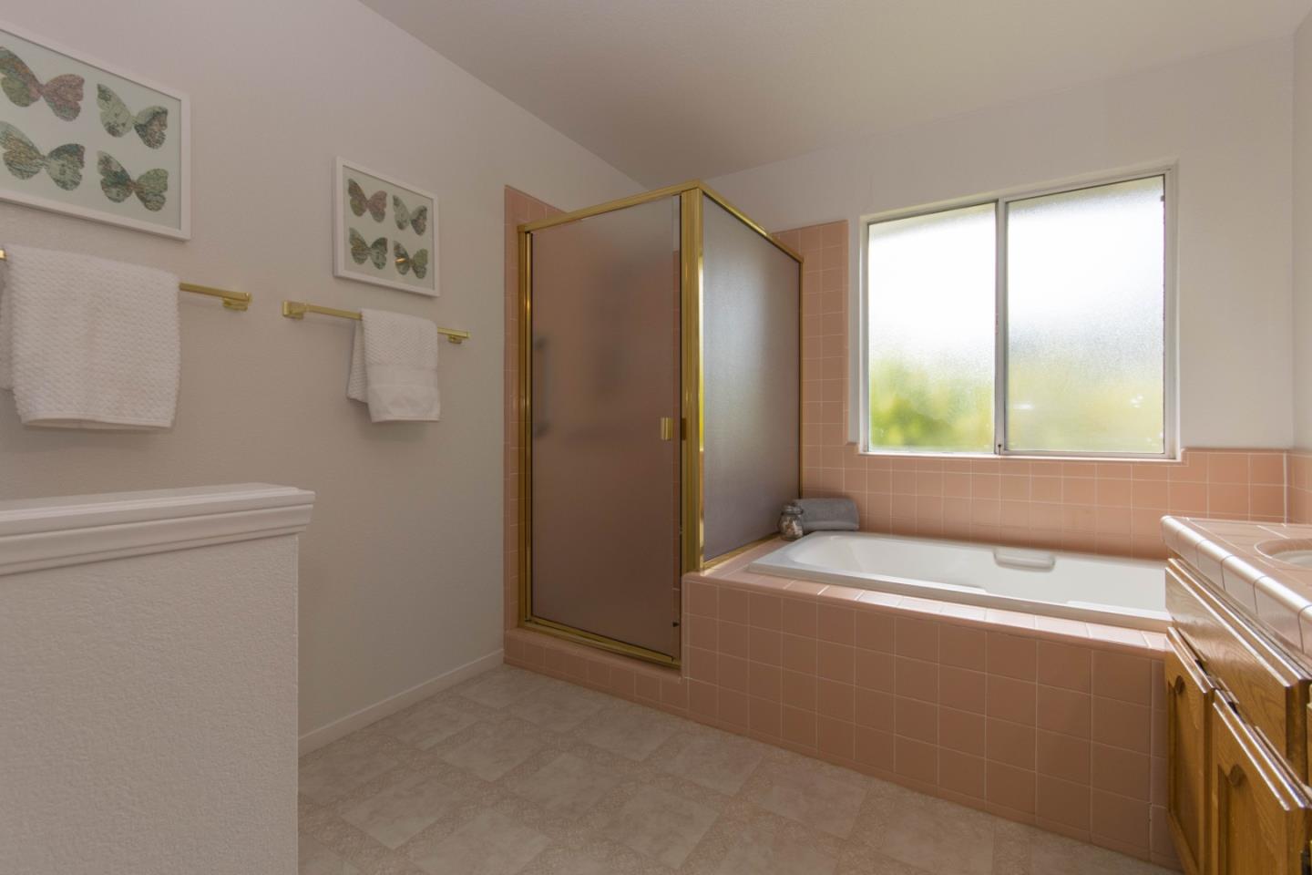 5980 Stone Bridge Road Santa Rosa, CA 95409 - Photo 11 of 24 a bathroom with a bathtub sink and toilet