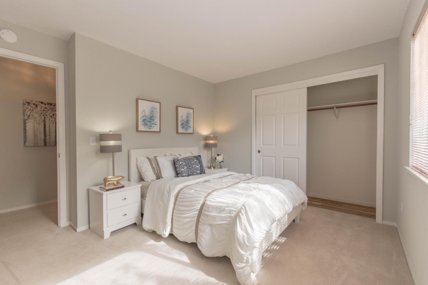 5980 Stone Bridge Road Santa Rosa, CA 95409 - Photo 12 of 24 a bedroom with a bed and a lamp