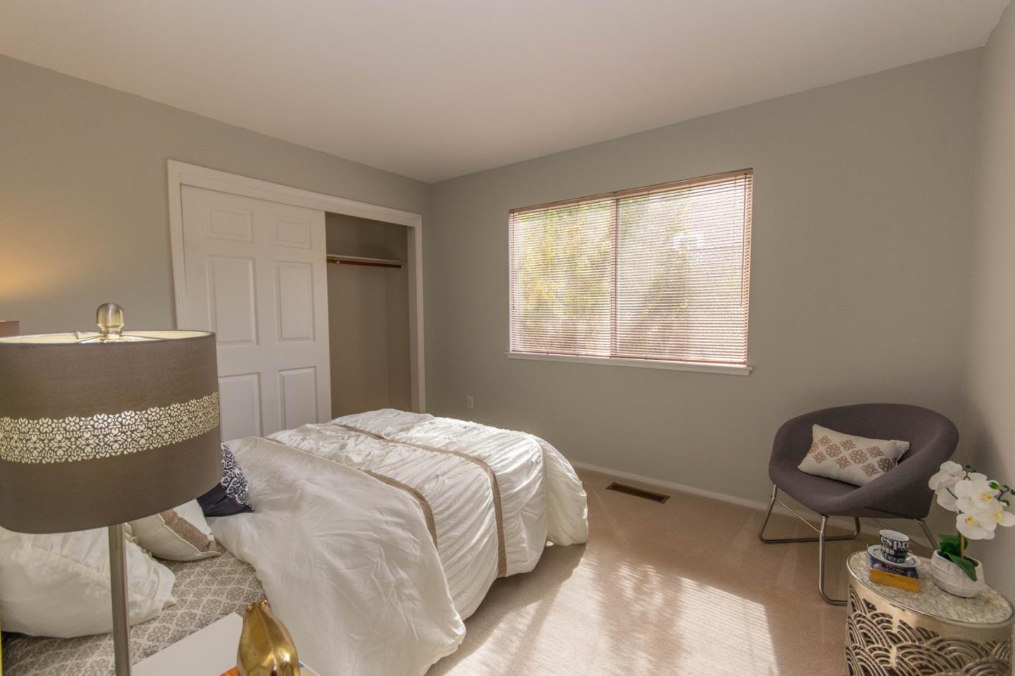 5980 Stone Bridge Road Santa Rosa, CA 95409 - Photo 14 of 24 a bedroom with a bed and a window