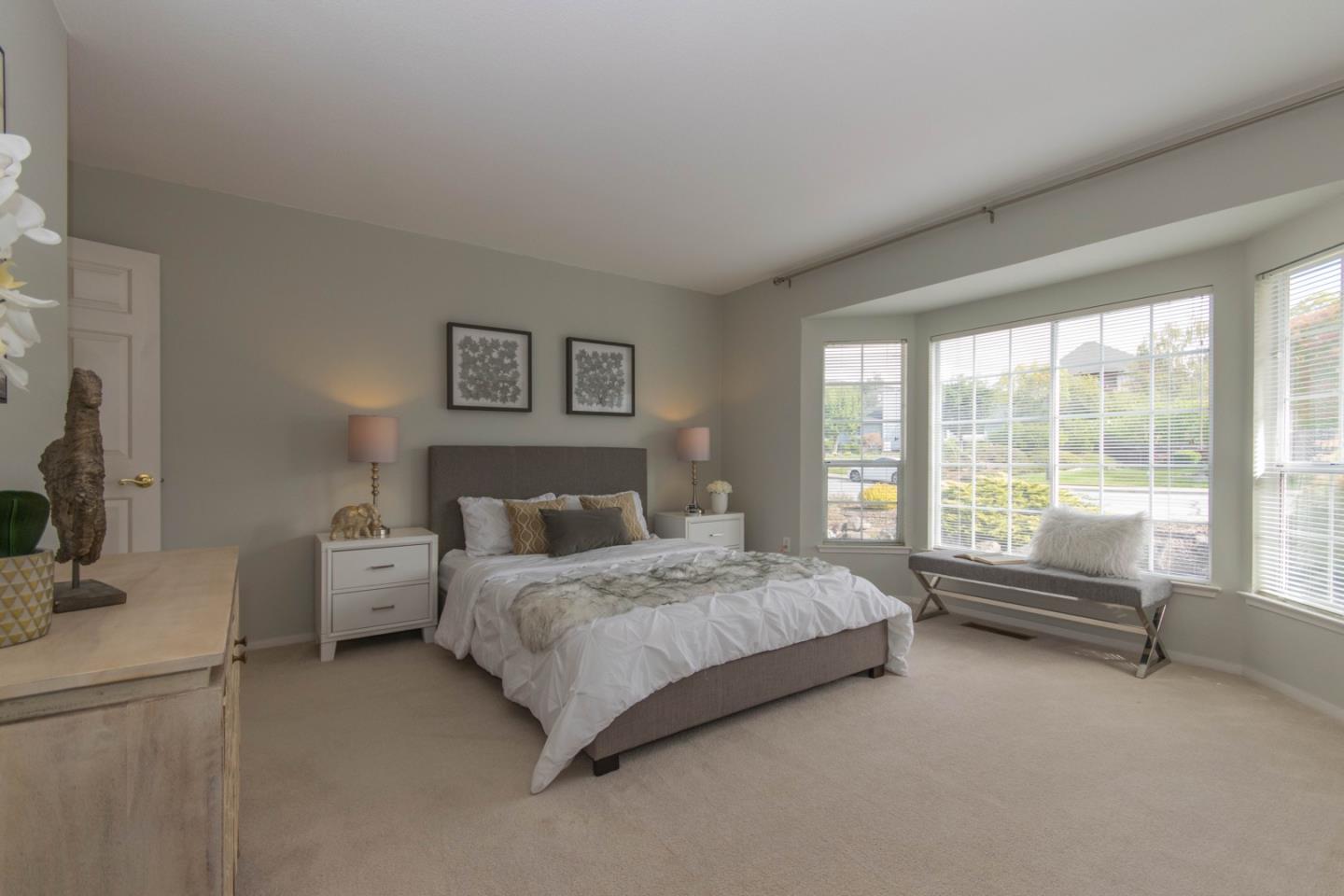 5980 Stone Bridge Road Santa Rosa, CA 95409 - Photo 15 of 24 a spacious bedroom with a bed and a large window