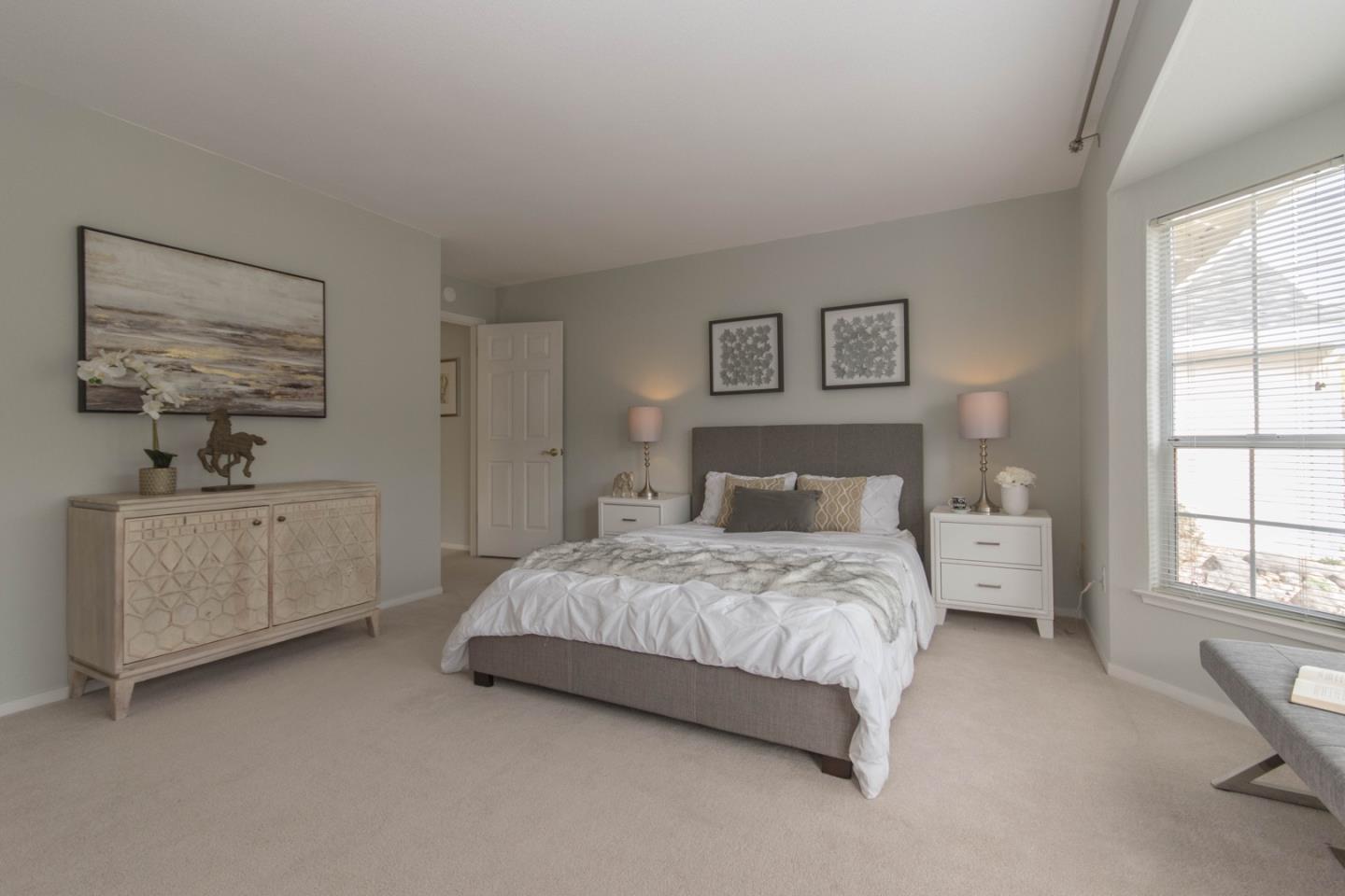 5980 Stone Bridge Road Santa Rosa, CA 95409 - Photo 16 of 24 a spacious bedroom with a bed and a window
